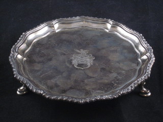 A circular silver salver with armorial decoration and bracketed  border, raised on 3 hoof supports, 6", Birmingham 1903, 5 ozs