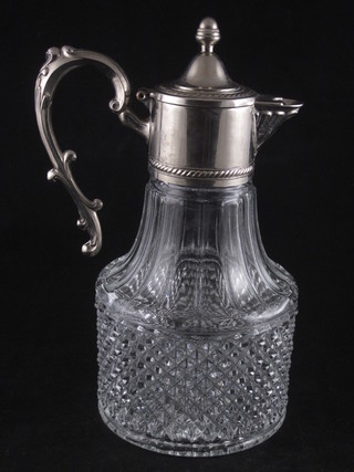 A moulded glass claret jug with plated mounts
