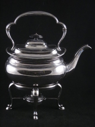 An oval Britannia metal tea kettle complete with stand