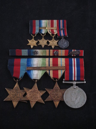 A group of 4 medals comprising 1939-45 Star, Atlantic Star with France and Germany clasp, Africa Star with North Africa clasp  1942-43, British War medal together with a group of 3  miniatures and ribbons