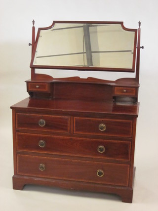 An Edwardian inlaid mahogany dressing chest with mirror, fitted  2 glove drawers above 2 short and 2 long drawers, raised on  bracket feet 42"