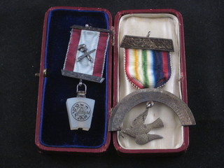 A silver Mark Master Masons breast jewel together with a silver Royal Ark Mariners jewel