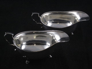 A pair of silver sauce boats, raised on hoof supports Birmingham 1928, 5 1/2 ozs