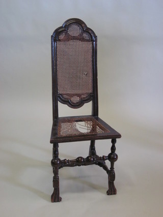 A 17th/18th Century walnut high backed chair with woven caned  seat and back, raised on turned and block supports   ILLUSTRATED
