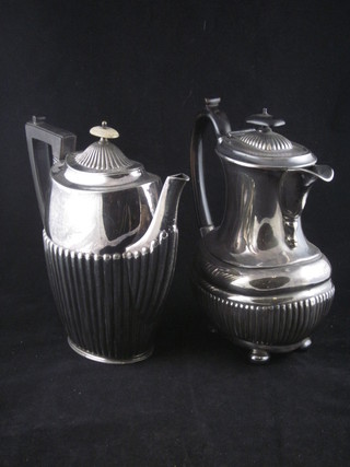An oval Britannia metal coffee pot with demi-reeded decoration and a similar hotwater jut