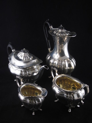 A Victorian silver 4 piece tea service of oval embossed shape comprising teapot, hotwater jug, twin handled sugar bowl and  cream jug, Sheffield 1899, 54 ozs ILLUSTRATED