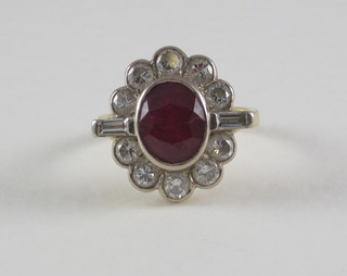A lady's 18ct yellow gold dress ring set an oval ruby surrounded  by diamonds  ILLUSTRATED