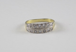 An 18ct yellow gold dress ring set 2 rows of diamonds