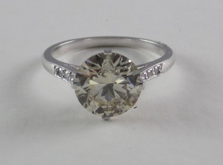 A lady's 18ct white gold dress/engagement ring set a solitaire  diamond and having 6 diamonds to the shoulders, approx 3.3ct