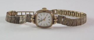 A lady's Rotary wristwatch contained in a 9ct gold case with integral gold bracelet