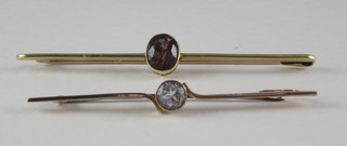 A 9ct gold bar brooch set an oval blue stone and 1 other set a red stone
