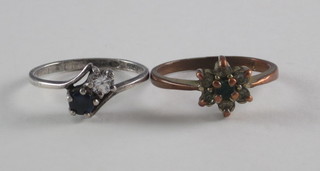 A silver dress ring set a blue and white stone and a gilt metal  dress ring