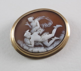 A Victorian shell carved cameo brooch decorated a classical  scene