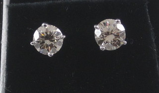 A pair of lady's diamond stud earrings, approx 1.20ct