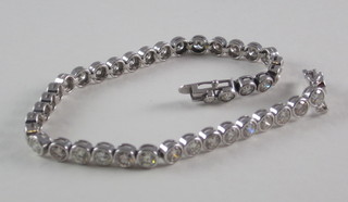 A lady's 14ct white gold bracelet, set circular cut diamonds,  approx 8ct