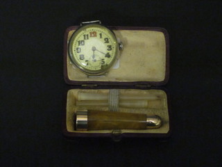 An amber and gold mounted cigar holder together with a silver cased wristwatch