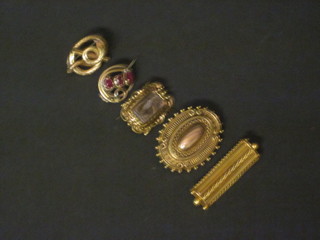A gilt metal mourning brooch and 4 gilt metal brooches