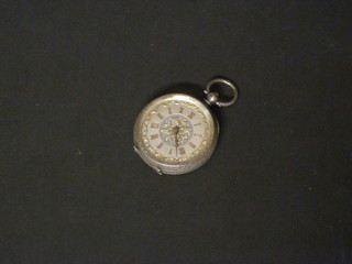 An open faced fob watch contained in a silver case