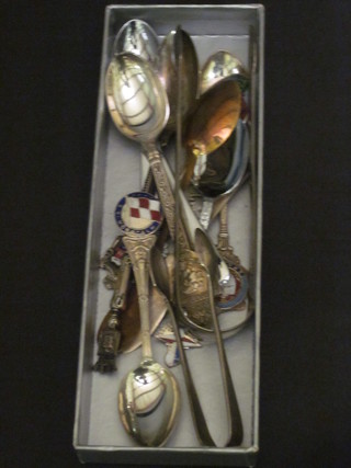 A small collection of souvenir spoons