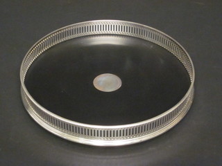 A circular silver plated galleried tea tray 10"