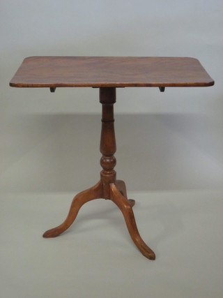 A 19th Century rectangular mahogany wine table, raised on a pillar and tripod base 29"