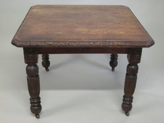 A Victorian carved oak extending dining table with 1 extra leaf,  39", raised on carved and turned supports