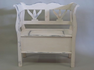 A white painted settle with hinged lid 34"
