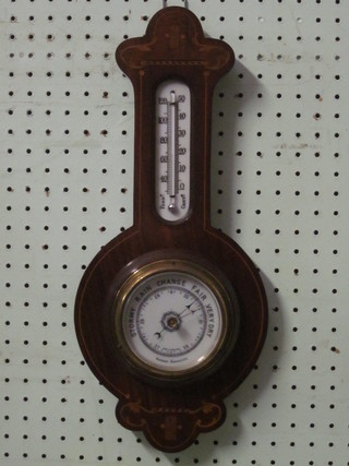 An Edwardian aneroid barometer and thermometer with porcelain  dial, contained in an inlaid mahogany wheel case