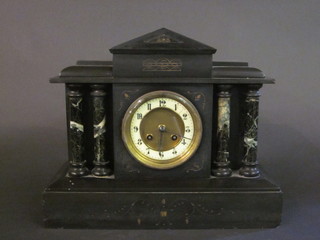 A Victorian French 8 day striking mantel clock with enamelled  dial and Arabic numerals, contained in a black veined marble  architectural case