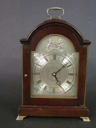 A Garrard 1977 Silver Jubilee limited edition chiming bracket  clock, the silver arched dial decorated the Royal Coat of Arms  and Royal palaces, no 3/250, contained in an arched mahogany  case with silver handle to the top and raised on silver bracket feet   ILLUSTRATED
