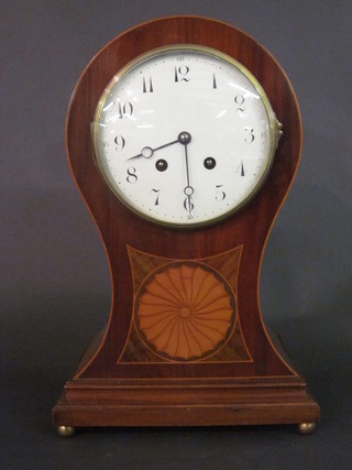 A French 8 day striking mantel clock with enamelled dial and Arabic numerals contained in an inlaid mahogany balloon shaped  case