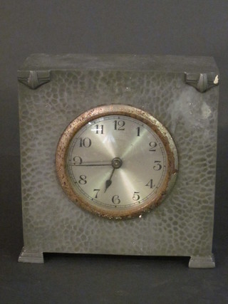 A mantel clock with silvered dial and Arabic numerals contained  in a planished pewter case, base marked My Lady Pewter