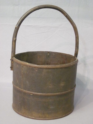 A reproduction well bucket with wooden handle
