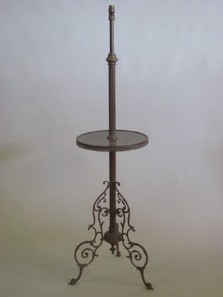 A gilt metal and onyx standard lamp