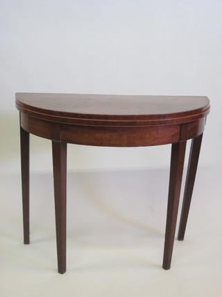 A 19th Century mahogany demi-lune card table, f, raised on  square tapering supports 35"