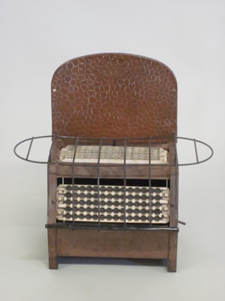 A WWII copper and metal heater/toaster, for decorative purposes only,