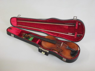 A violin labelled Josef Klots Meftenwalde Anno 1775, together  with 2 bows, cased