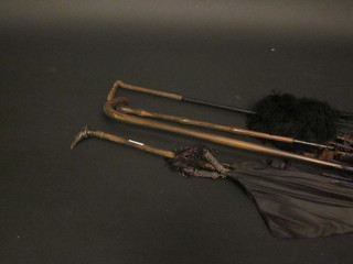 A lady's Edwardian parasol, the handle in the form of a birds head, together with 3 other parasols