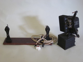 A Kodascope 16mm model EE projector together with a Blackson  & Kenridge 16mm film winder