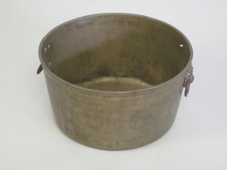 A circular brass twin handled planter with lion mask handles 14"