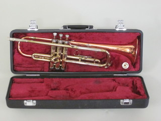 A Conn brass and copper trumpet