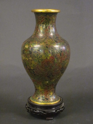 A green ground and floral patterned cloisonne vase 10"