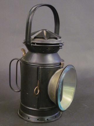 A metal railway hand lantern marked SWR