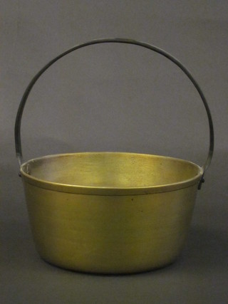 A circular brass preserving pan with iron handle 9"