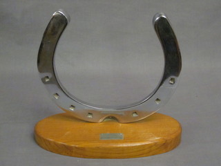 A large horse shoe marked from Tetley Horse to Lawrence  Langley