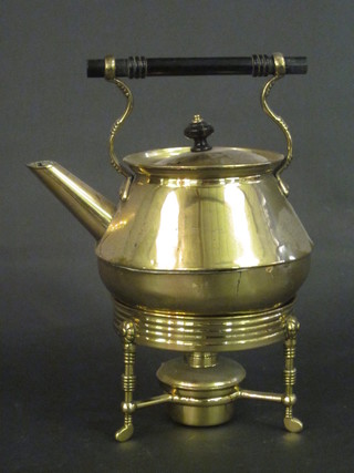 A circular brass Dresser style tea kettle and stand complete with burner,  ILLUSTRATED