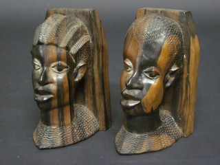 A pair of African bookends carved portrait busts 7"