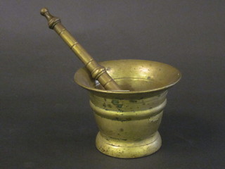 A brass mortar and pestle