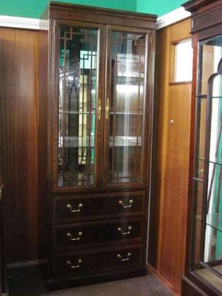 A Georgian style mahogany display cabinet, the interior fitted  shelves enclosed by astragal glazed panelled doors, the base fitted  3 long drawers, raised on bracket feet 31"