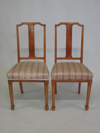 A pair of Edwardian satinwood bedroom chairs